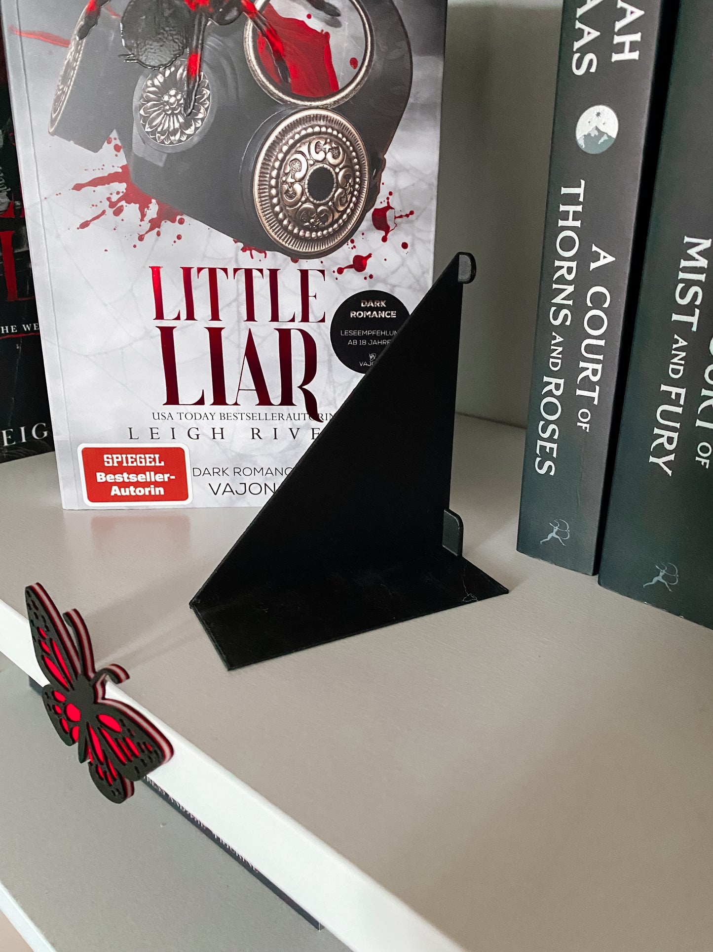 Unsichtbare Buchstütze